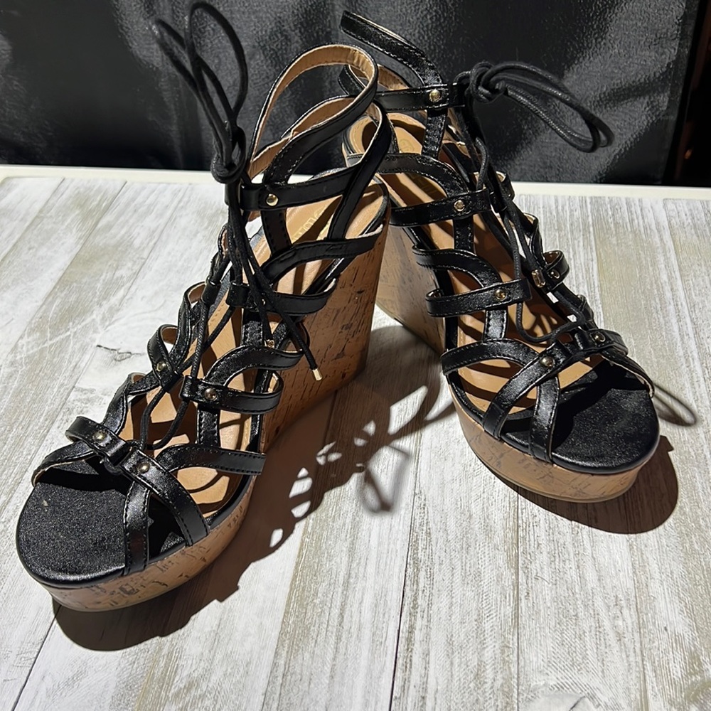 Brash black Slayy gladiator wedges